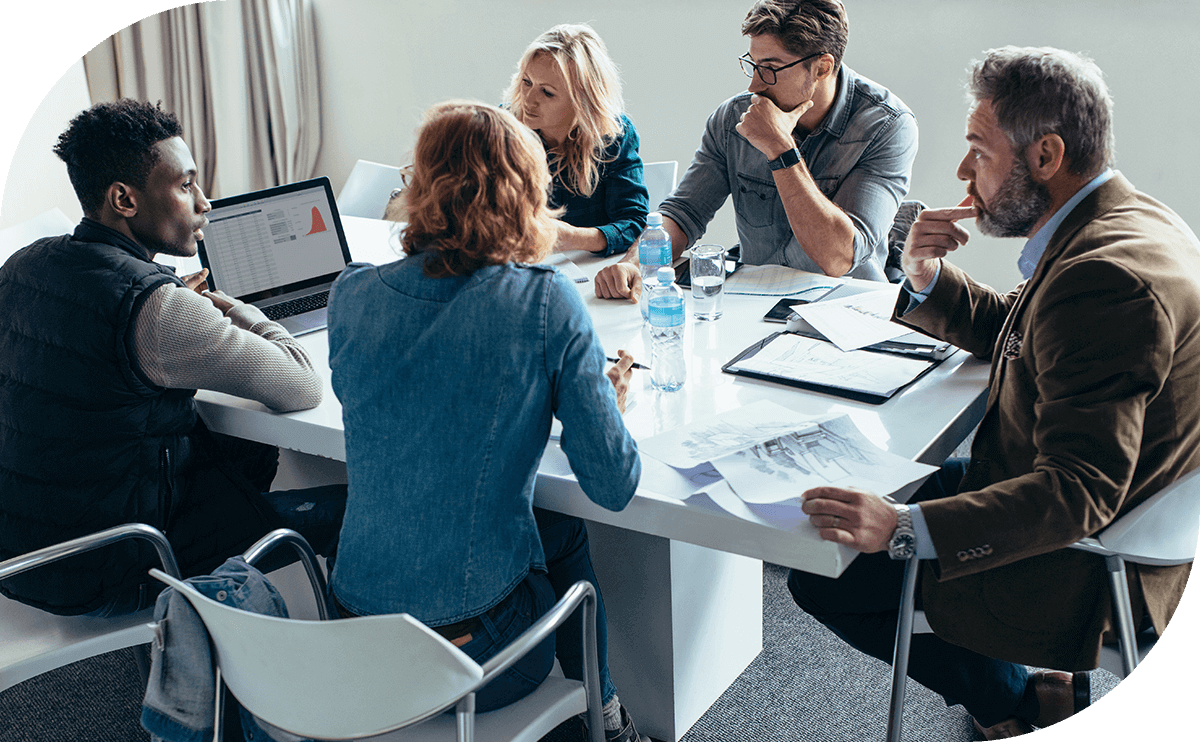 Founders reviewing an operating agreement together at a desk