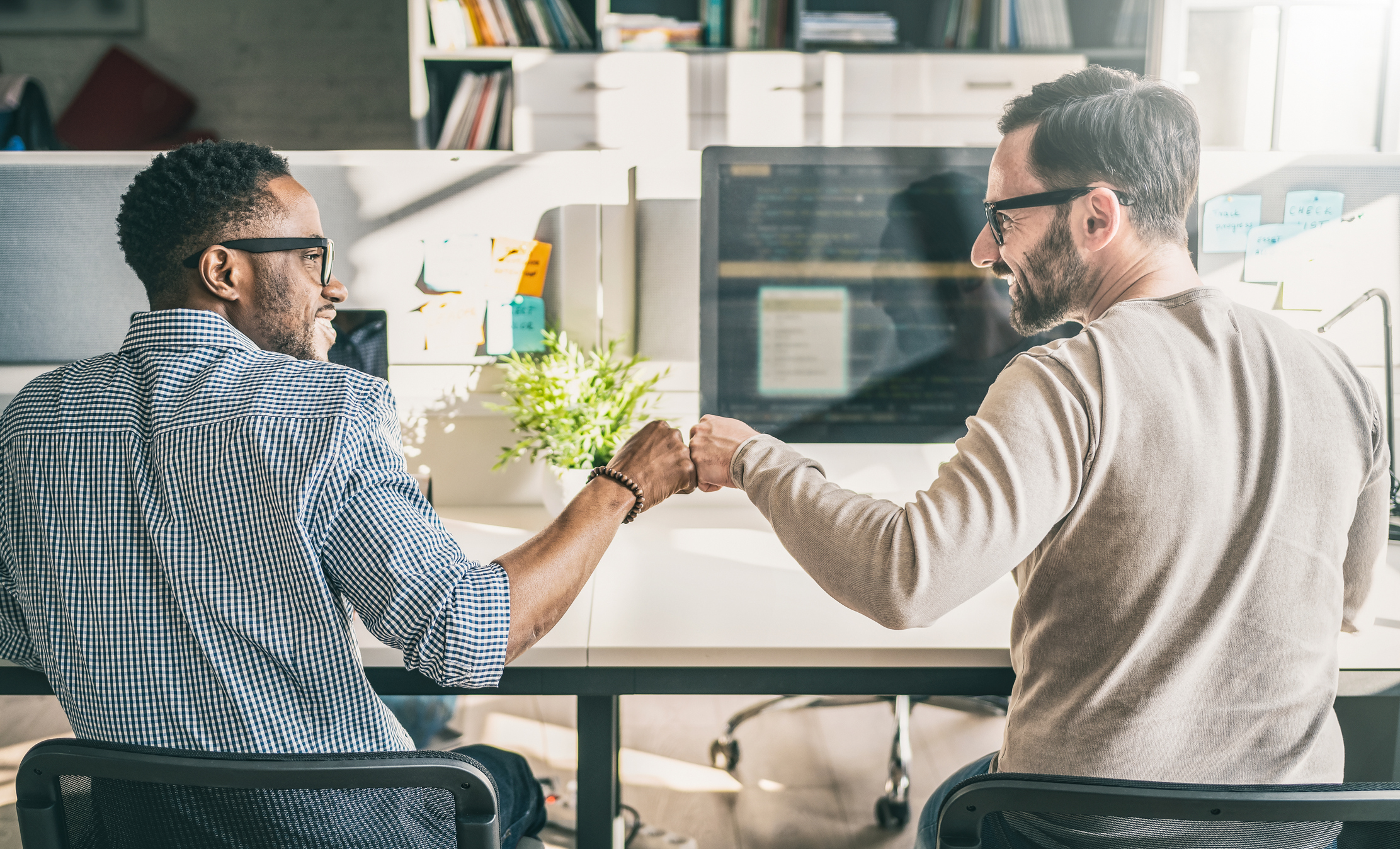 Business partners signing limited liability company formation documents